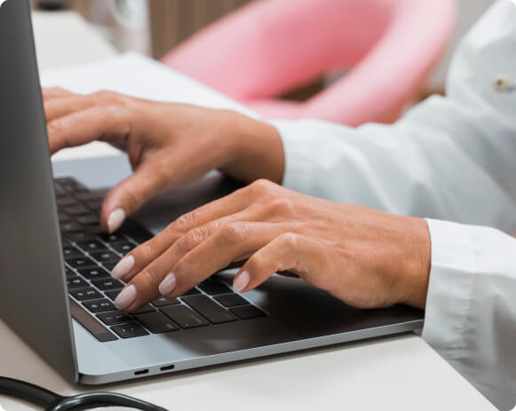 doctor-working-laptop-close-up-physios